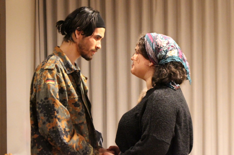 Two actors facing each other during the class Epic Theatre Scene Showing